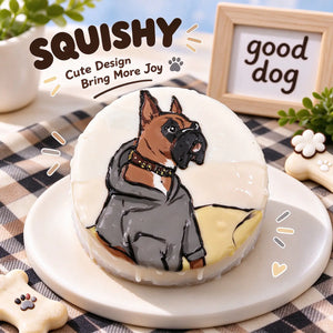 Hand-painted Boxer squishy toy, cute Boxer dog portrait on soft round fidget toy, light cream glossy surface with brown black face, gray hoodie and studded collar details