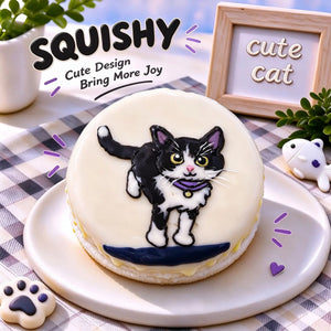 Hand-painted Devon Rex squishy toy, cute Devon Rex cat portrait on soft round fidget toy, light cream glossy surface with black white markings and teal collar accent