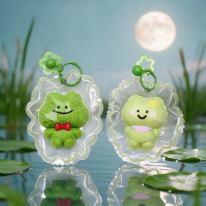 Several green frog-shaped squishy charms displayed together.