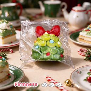 Three green Christmas tree-shaped charms with red bows displayed together.