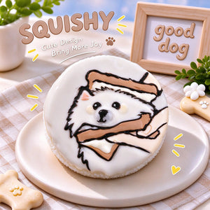 Hand-painted Pomeranian squishy toy, cute Pom dog portrait on soft round fidget toy, white glossy surface with tan accents and playful painted details