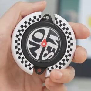 SpinCall gift demonstration video, showing the black and white checkerboard decision spinner keychain's rotating function, displaying the YES NO fidget toy spinning effect and portable carrying usage