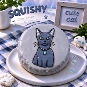 Hand-painted Russian Blue squishy toy, cute Russian Blue cat portrait with pearl necklace and teal pendant on soft round fidget toy, gray glossy surface on display plate