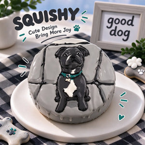 Hand-painted Staffy squishy toy, cute Staffy dog portrait with teal collar on soft round fidget toy, gray cracked glossy surface on display plate